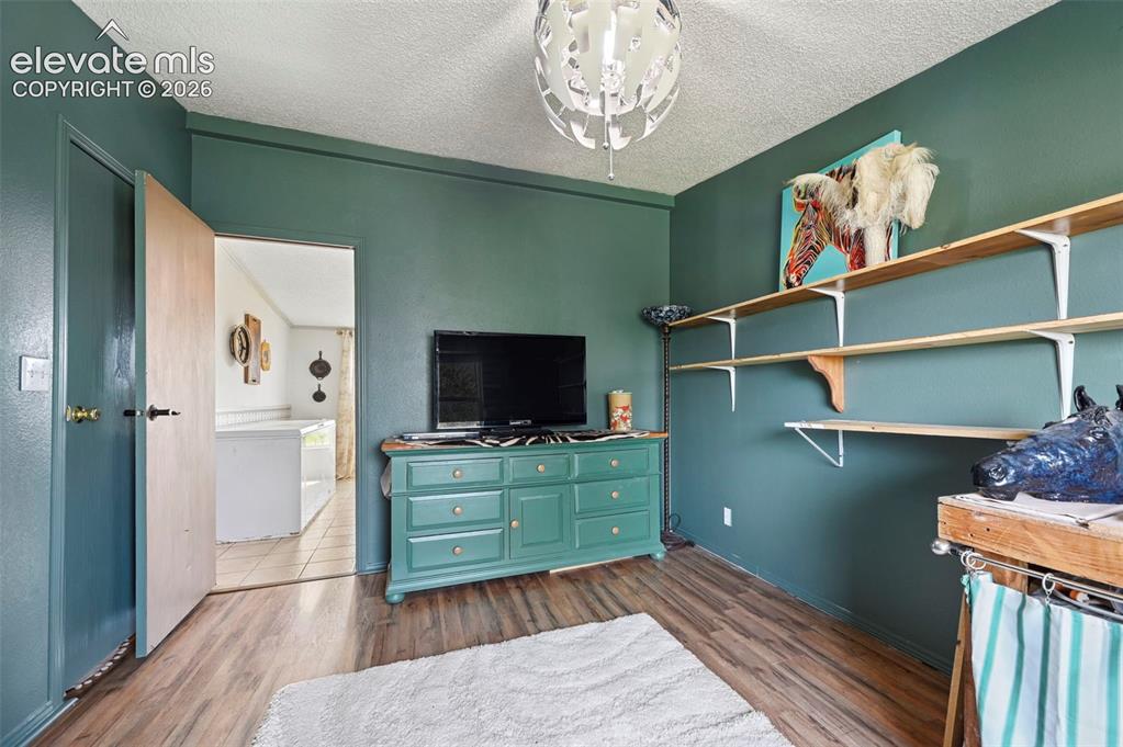 Image 27 of 49: #2 Bedroom with LVP flooring