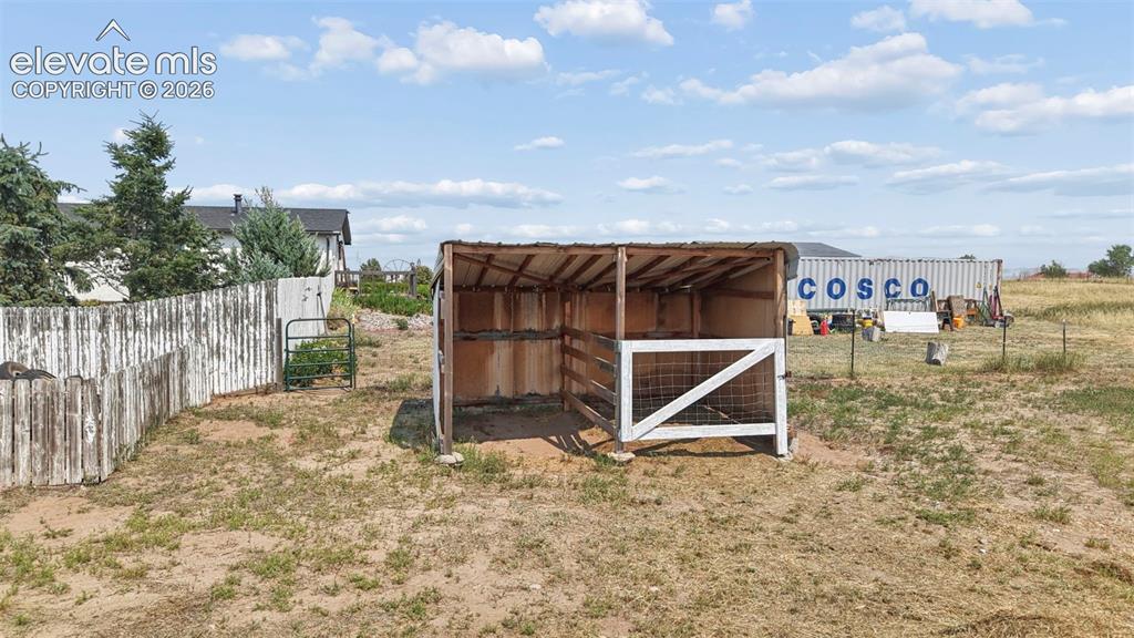 Image 34 of 49: Raised Carport-Conex Buildings Exclused