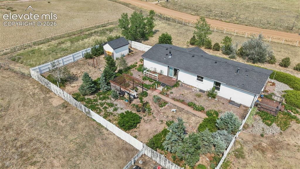 Image 36 of 49: Showing Fenced in Backyard Oasis!