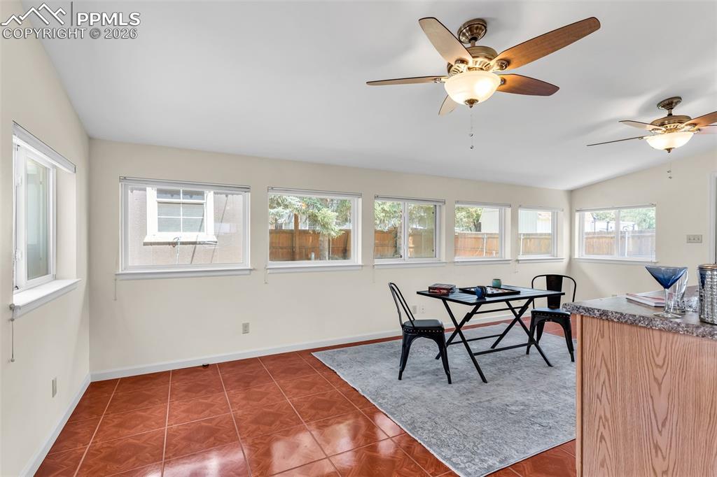 Image 16 of 42: Sunroom with lofted ceiling