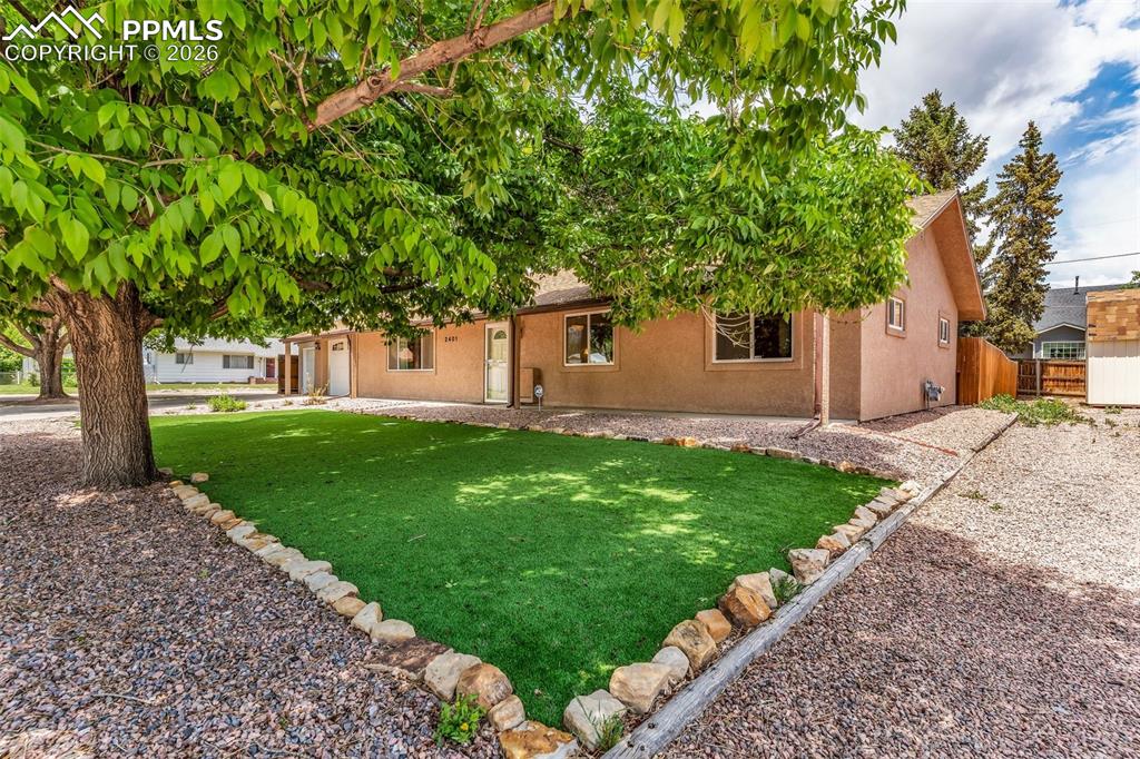 Image 41 of 42: View of front of property with stucco siding and an attached garage