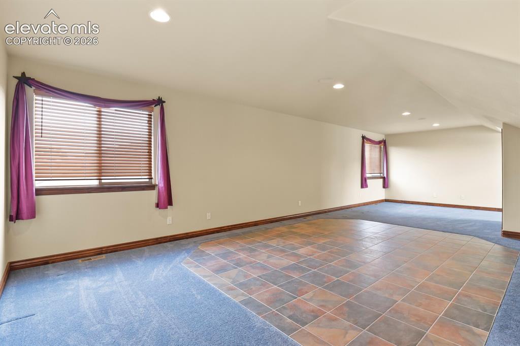 Image 21 of 33: Large bedroom/loft/hobby room area on the upper level