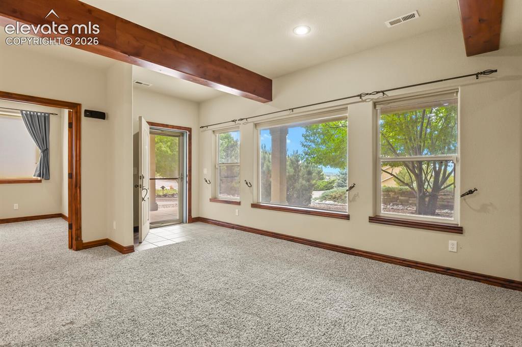 Image 24 of 33: Lower level private entrance with living space