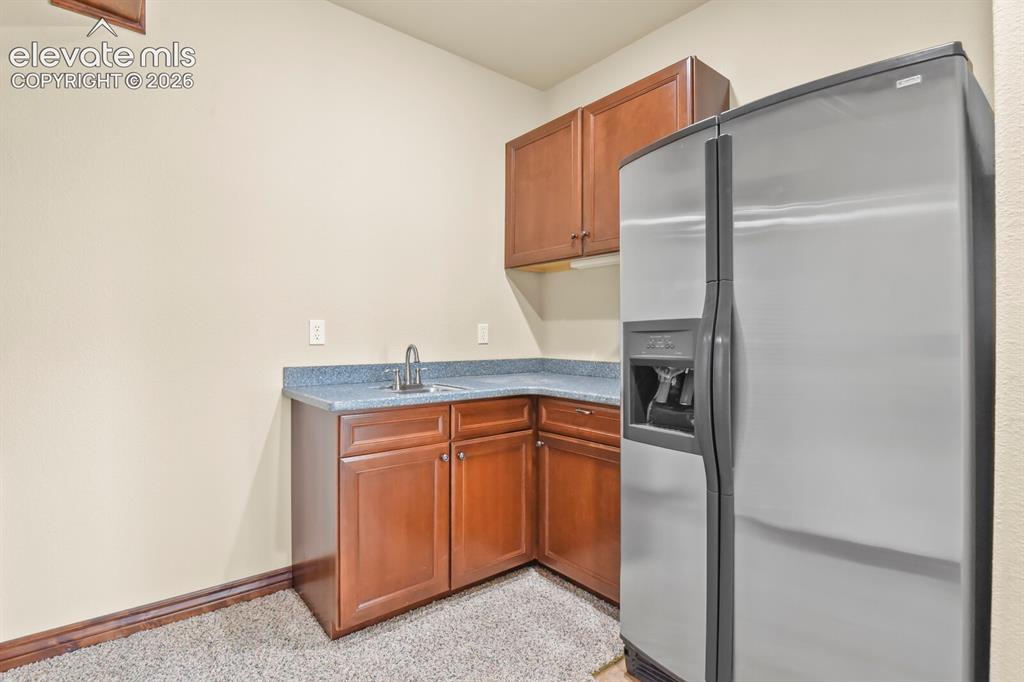 Image 25 of 33: Lower level kitchenette could easily be expanded upon