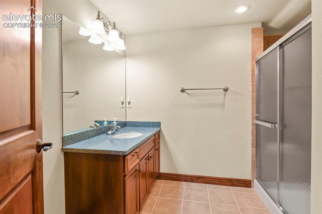 Image 28 of 33: Lower level bathroom