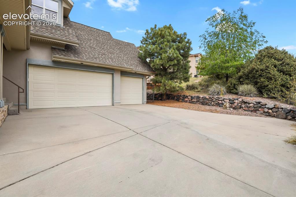Image 3 of 33: Three Car attached garage.