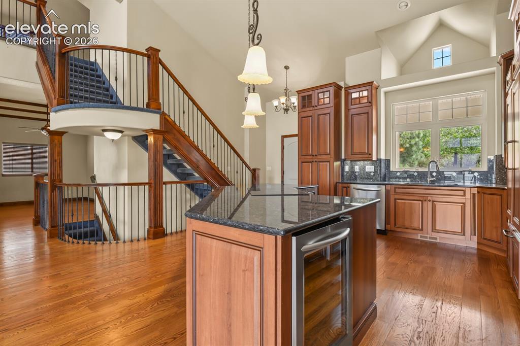 Image 6 of 33: Kitchen view with upper and lower staircases