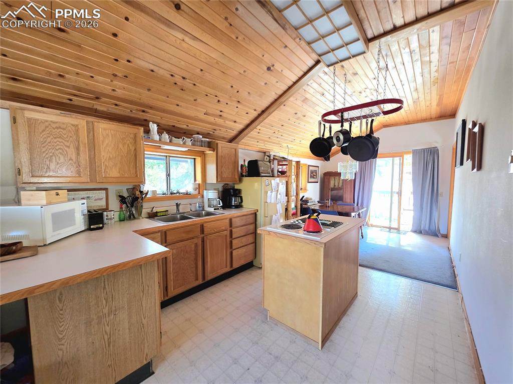 Image 16 of 40: Open to the living room and dining room