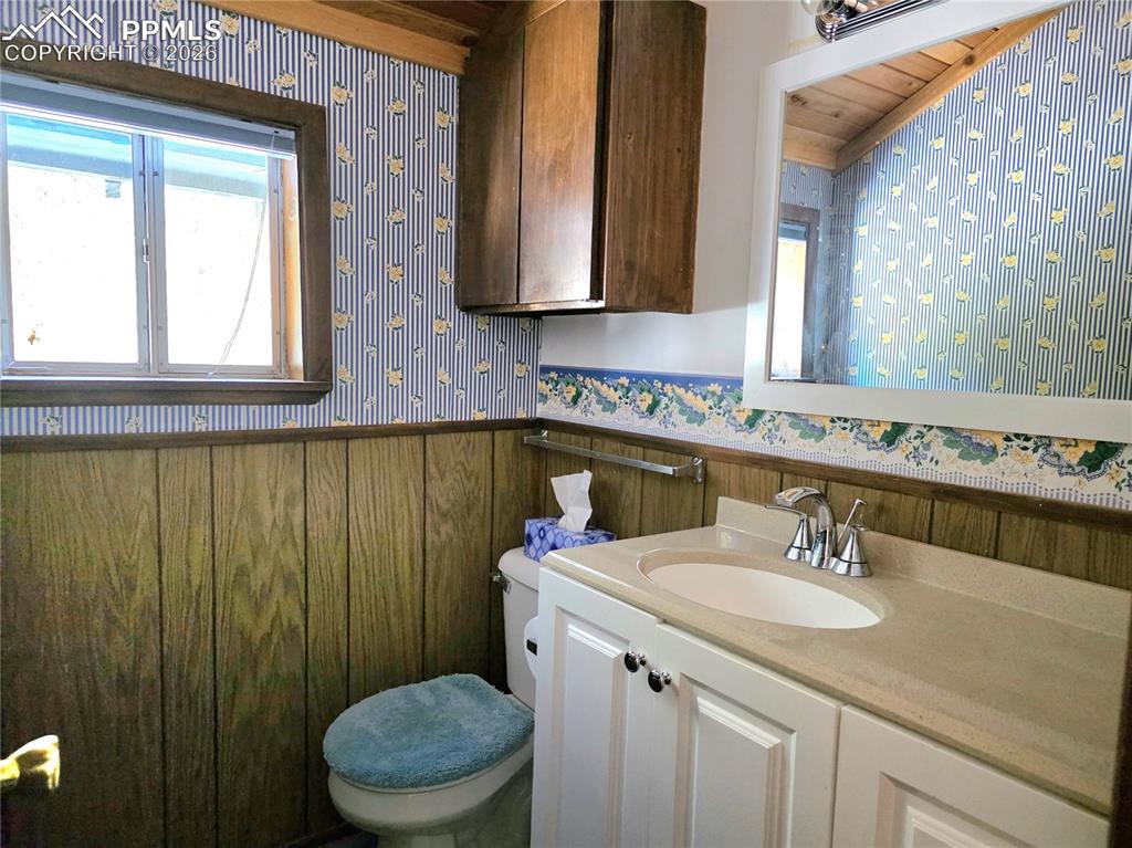 Image 20 of 40: primary bedroom ensuite half bath 