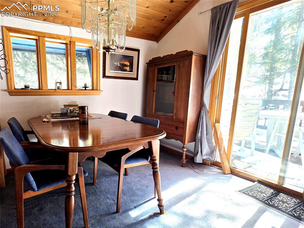 Image 21 of 40: Dining room walks out to the back deck 