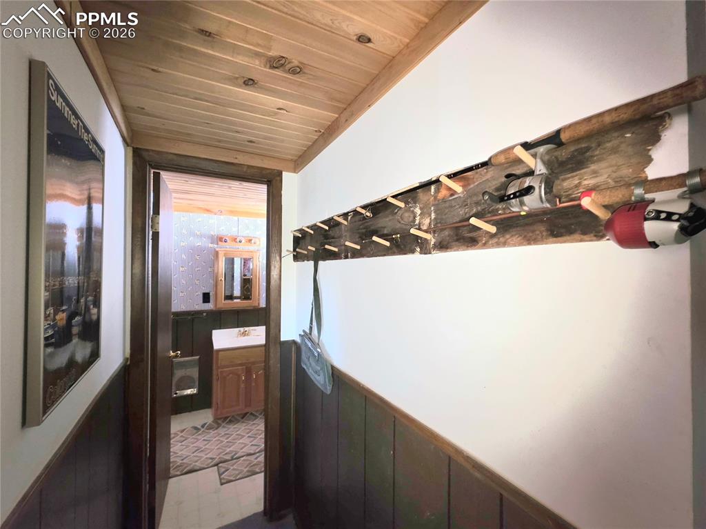 Image 29 of 40: Lower level entry hall to bathroom