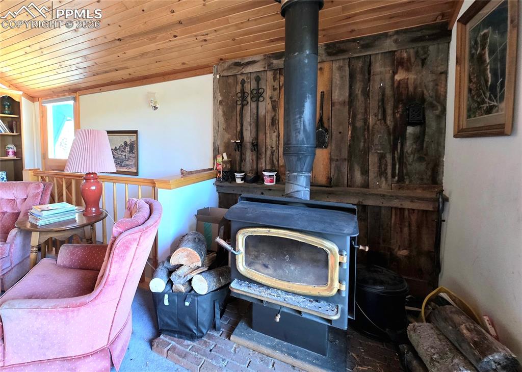 Image 7 of 40: Avalon woodstove in upper level living room