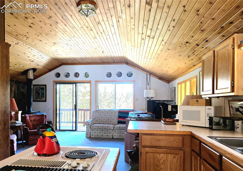 Image 9 of 40: Open living includes LR, Kitchen and Dining