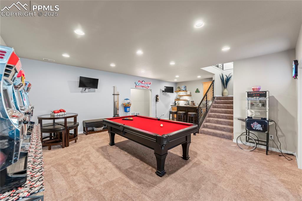 Image 38 of 50: Playroom with carpet flooring, recessed lighting, and billiards