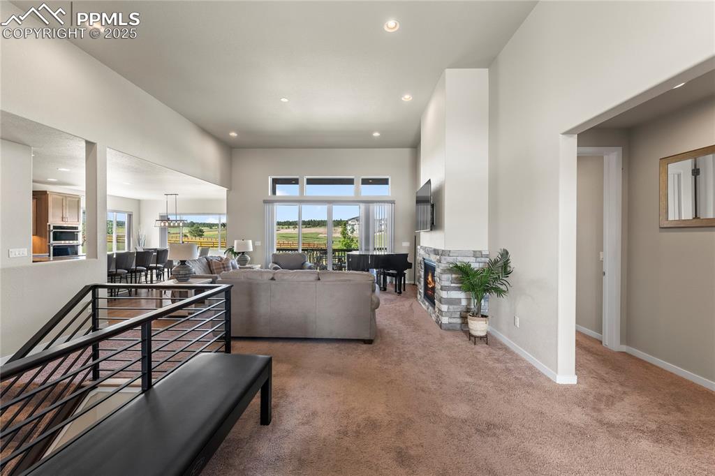 Image 9 of 50: Living room featuring carpet, healthy amount of natural light, recessed lig