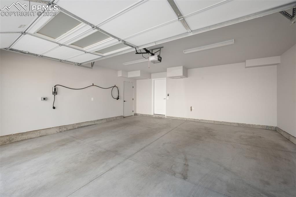 Image 19 of 27: Convenient lower-level access to a spacious two-car garage