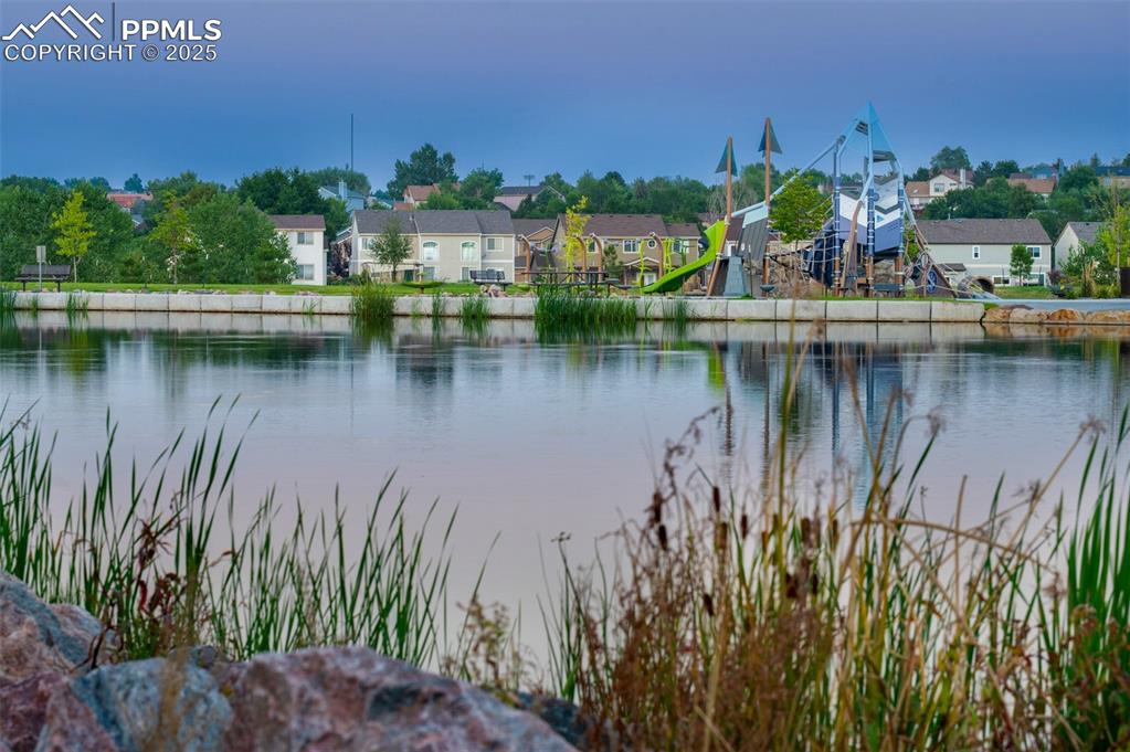 Image 22 of 27: Serene pond views right outside your door—nature’s backdrop for everyday li