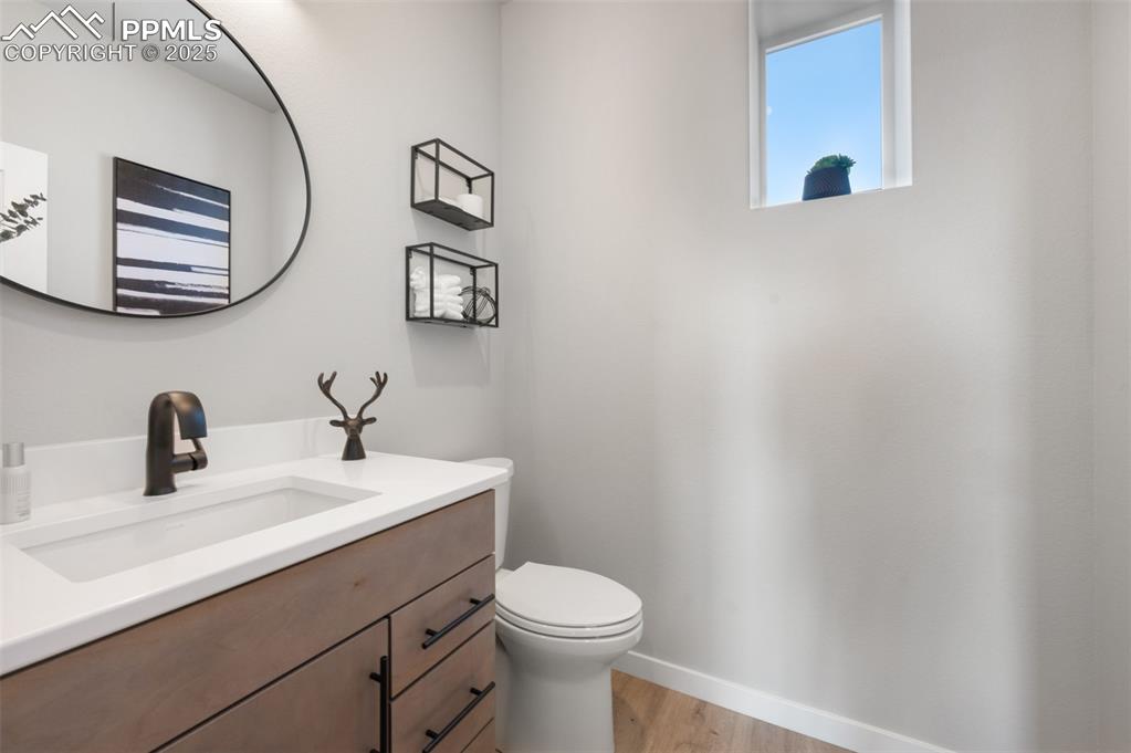 Image 8 of 27: Chic main-level half bath, fully upgraded with stylish finishes