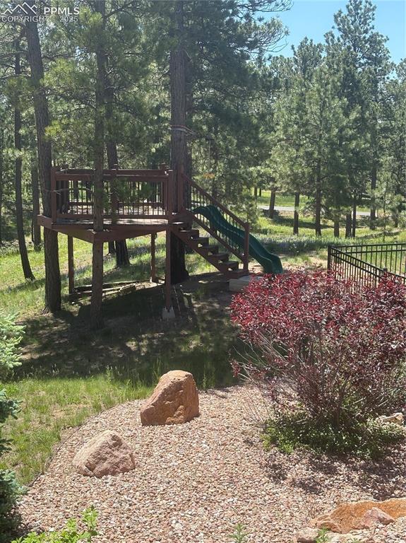 Image 14 of 44: Tree house to the right of the front door with zip line