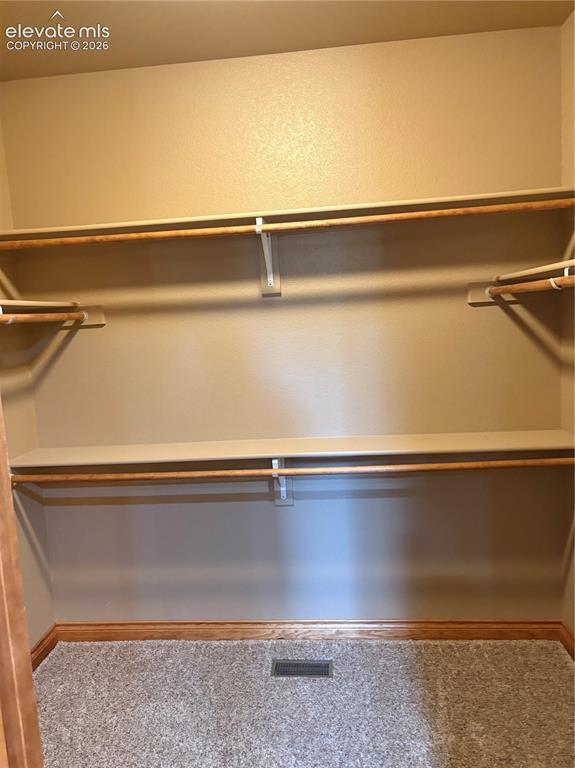 Image 22 of 44: Primary walk in closet