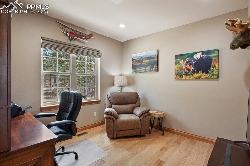 Image 24 of 48: Home office with recessed lighting, visible vents, light wood-style floorin