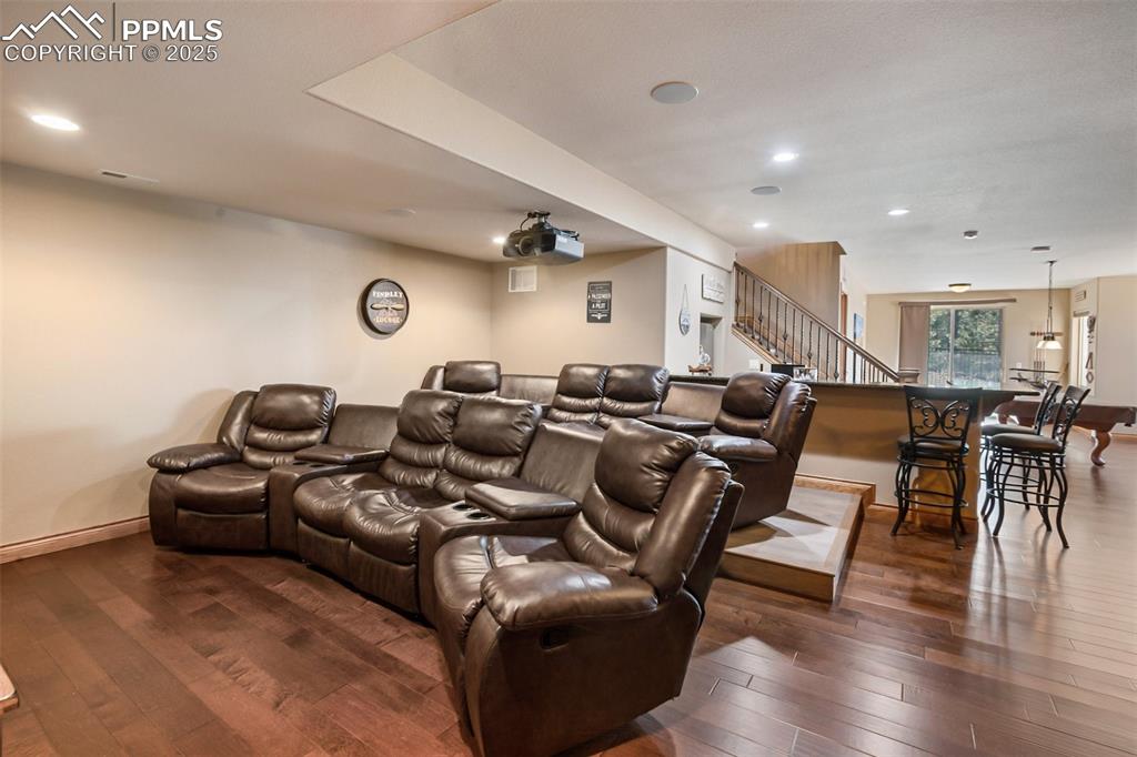 Image 40 of 48: Cinema featuring recessed lighting, dark wood-style floors, and baseboards