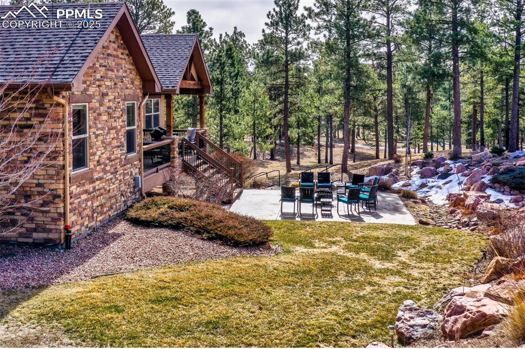 Image 8 of 48: View of yard featuring a patio area and stairs