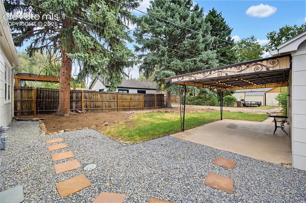 Image 29 of 38: Covered patio with fresh rock