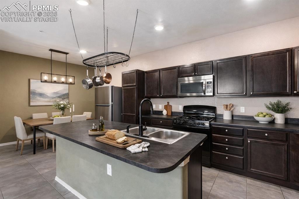 Image 3 of 31: Virtually Staged - Dining Room Light Fixture is virtually added