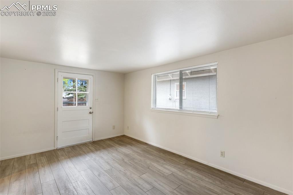 Image 11 of 34: Living room features LVP flooring
