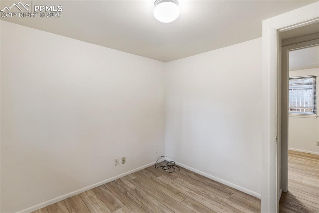 Image 15 of 34: One of 2 bedrooms. Freshly painted and featuring low maintenance LVP floori