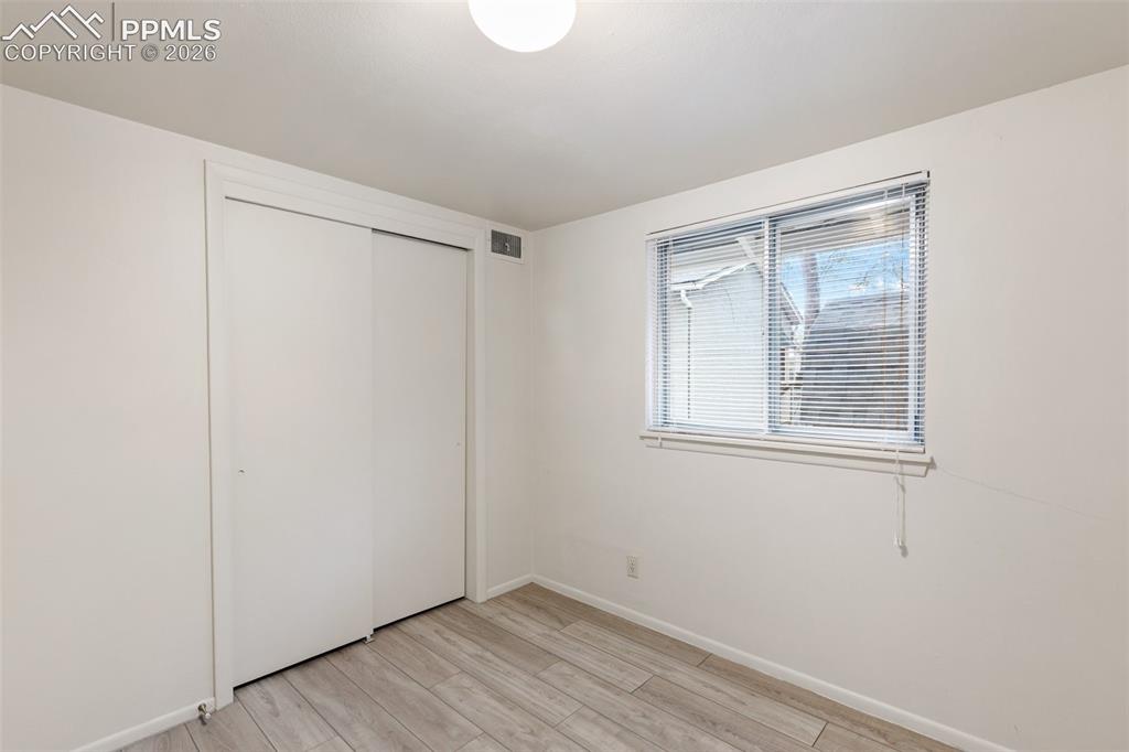 Image 18 of 35: One of 2 bedrooms - featuring LVP flooring.