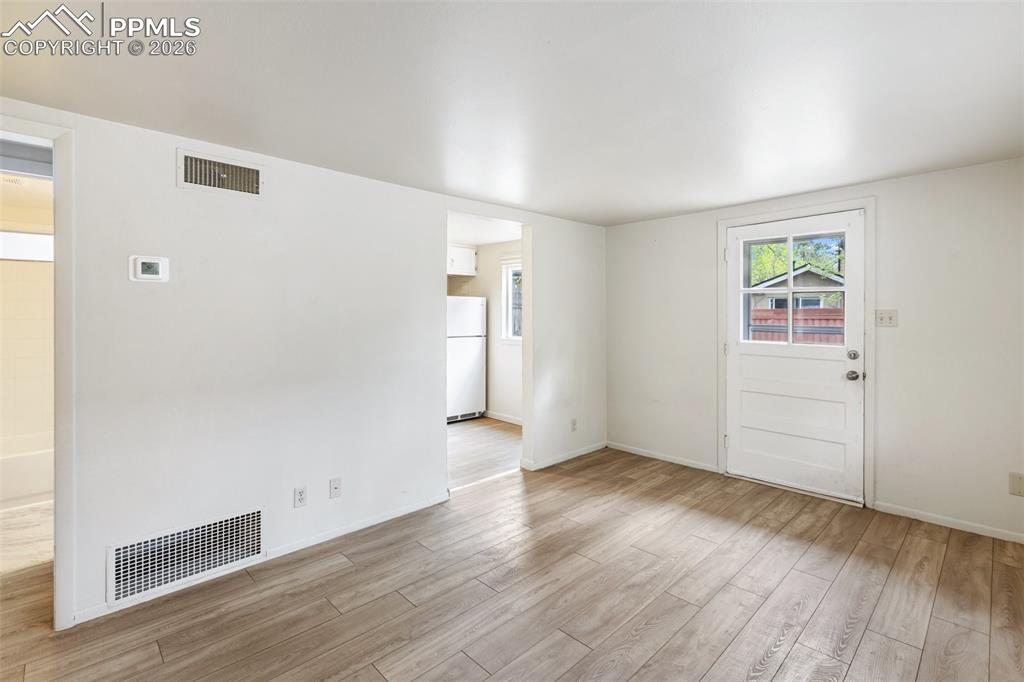 Image 9 of 34: Living room features easy maintenance LVP flooring