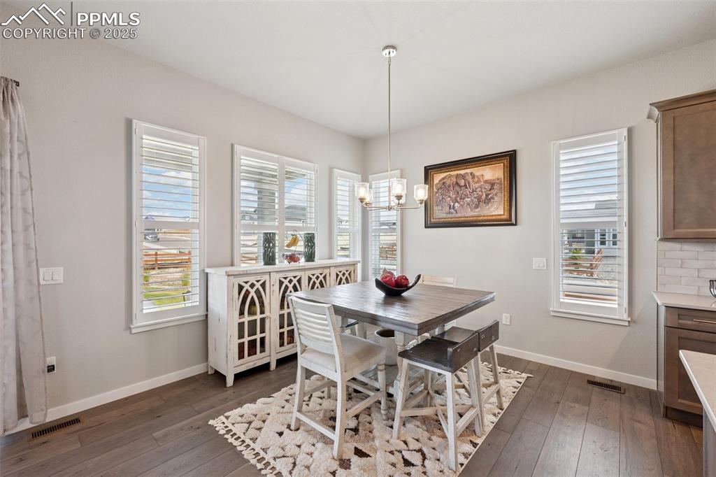 Image 13 of 45: Spacious dining area with plantation shutters!