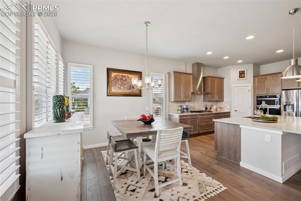 Image 14 of 45: Another view of the kitchen and dining area!