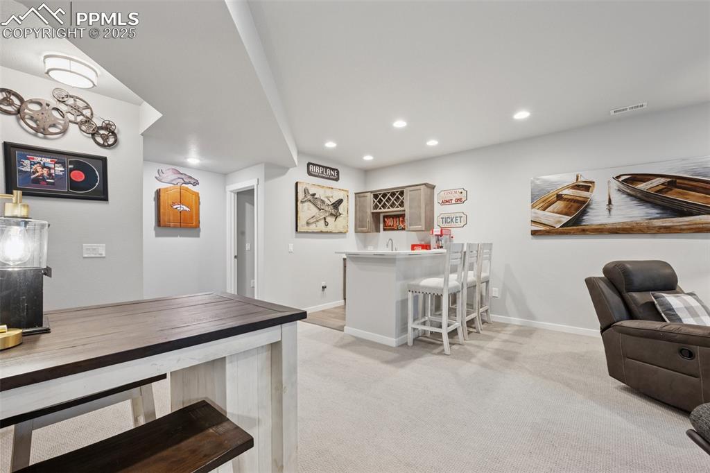 Image 32 of 45: Wet bar and dart board included!
