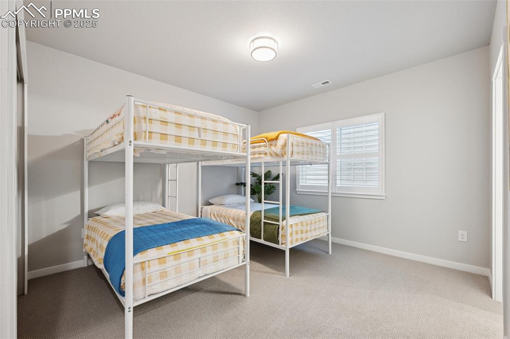 Image 36 of 45: Fourth bedroom with another walk in closet!