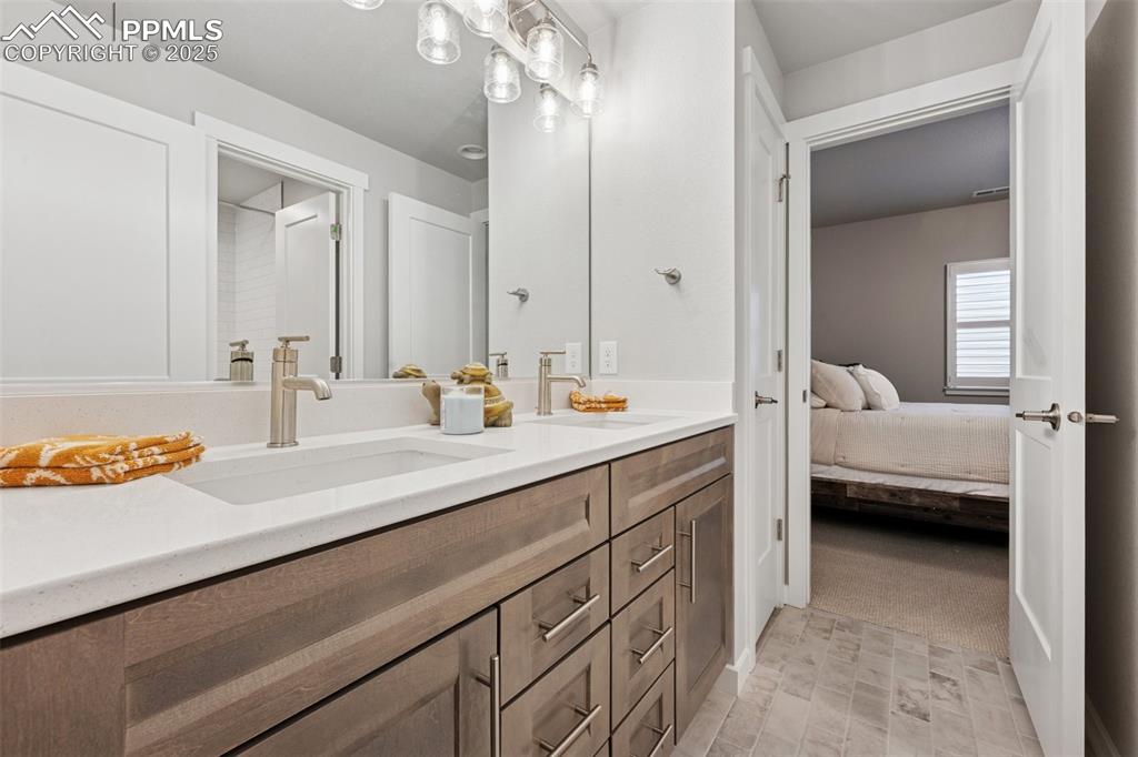 Image 38 of 45: Fourth bath is a Jack-n-Jill bath to bedroom four and five.
