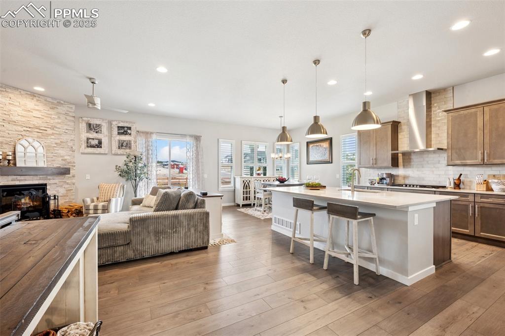 Image 6 of 45: Open floor plan and upgrades throughout!  Upgraded lighting!