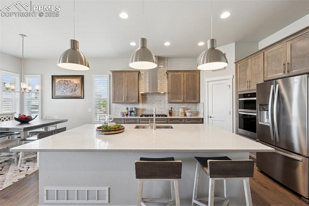Image 9 of 45: Large island and stainless hood!