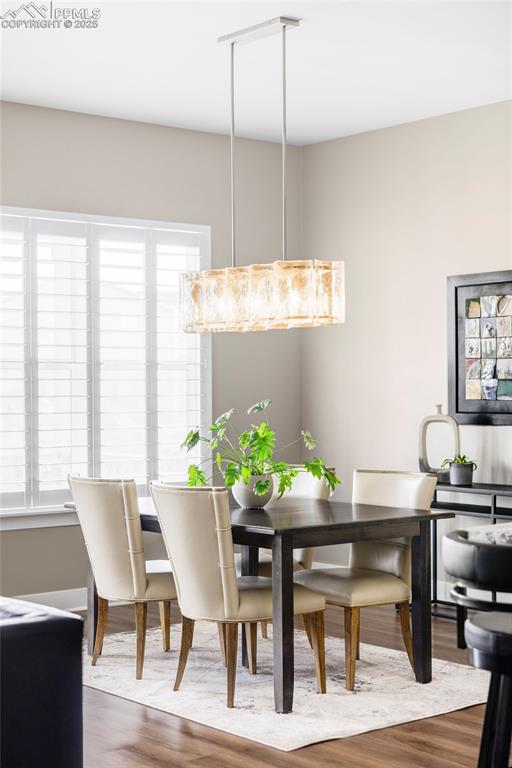 Image 11 of 44: Dining room featuring wood finished floors