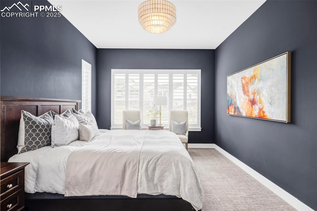 Image 21 of 44: Carpeted bedroom with baseboards