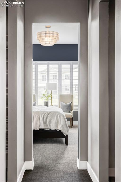 Image 22 of 44: Bedroom with carpet floors and baseboards