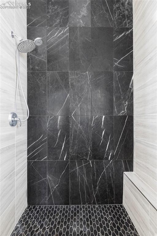 Image 25 of 44: Bathroom with tiled shower