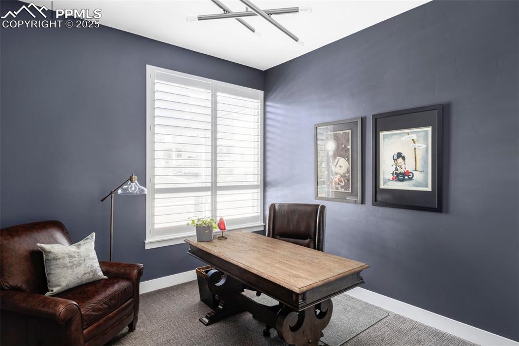 Image 33 of 44: Office area with baseboards and carpet flooring