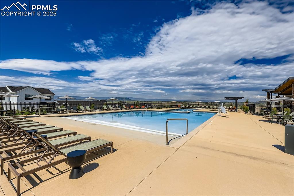 Image 44 of 44: Community pool featuring a patio area