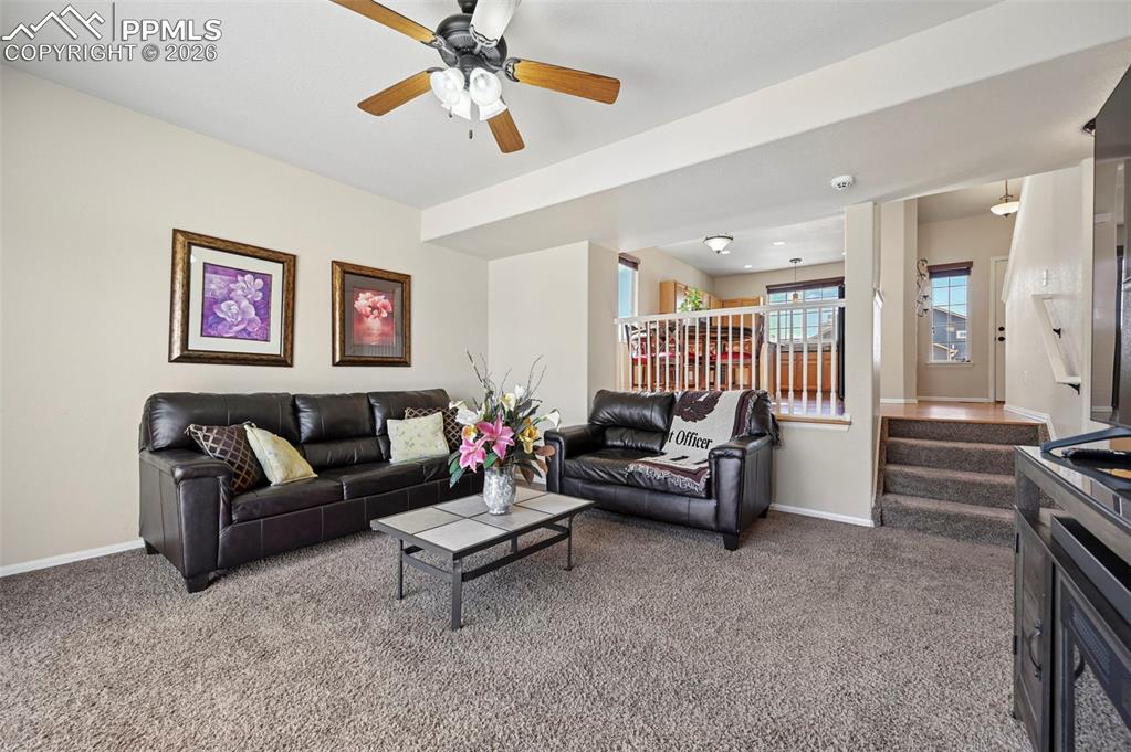 Image 16 of 44: A sunken family room that radiates warmth and coziness.