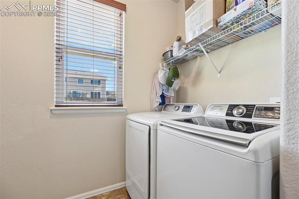 Image 36 of 44: Spacious laundry room.