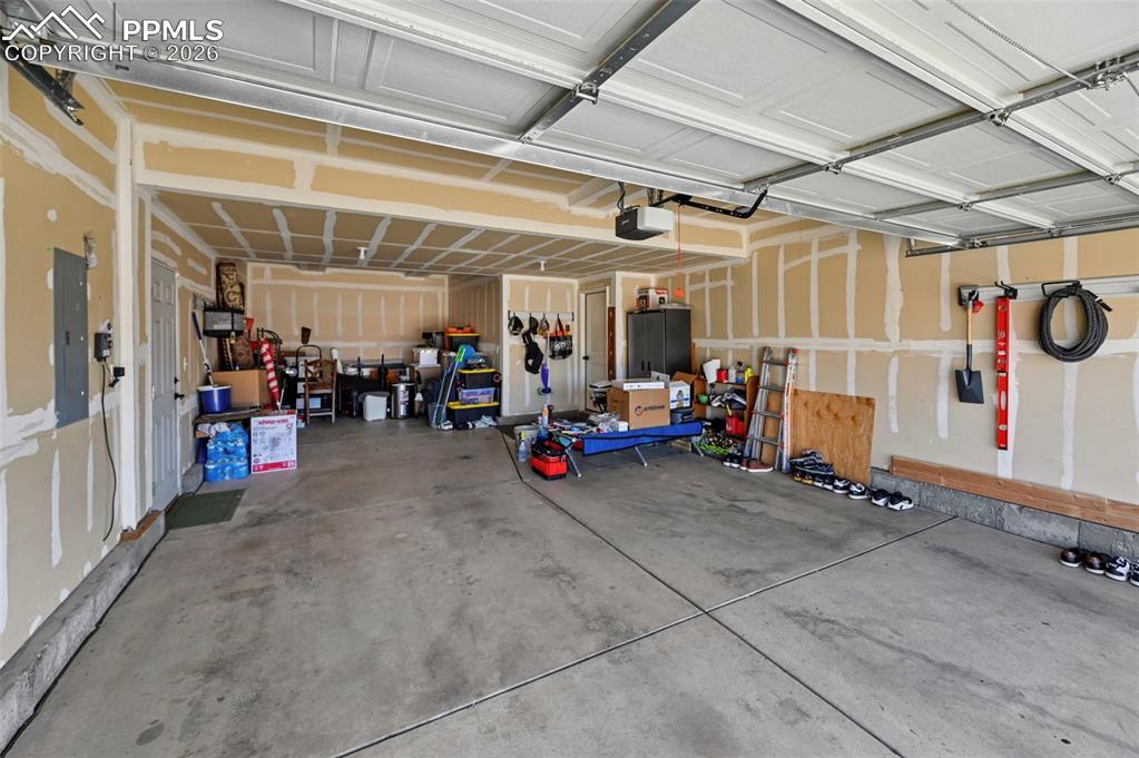 Image 39 of 44: Three car tandem garage.