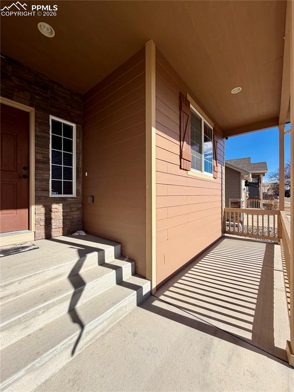 Image 5 of 44: Inviting covered front porch.